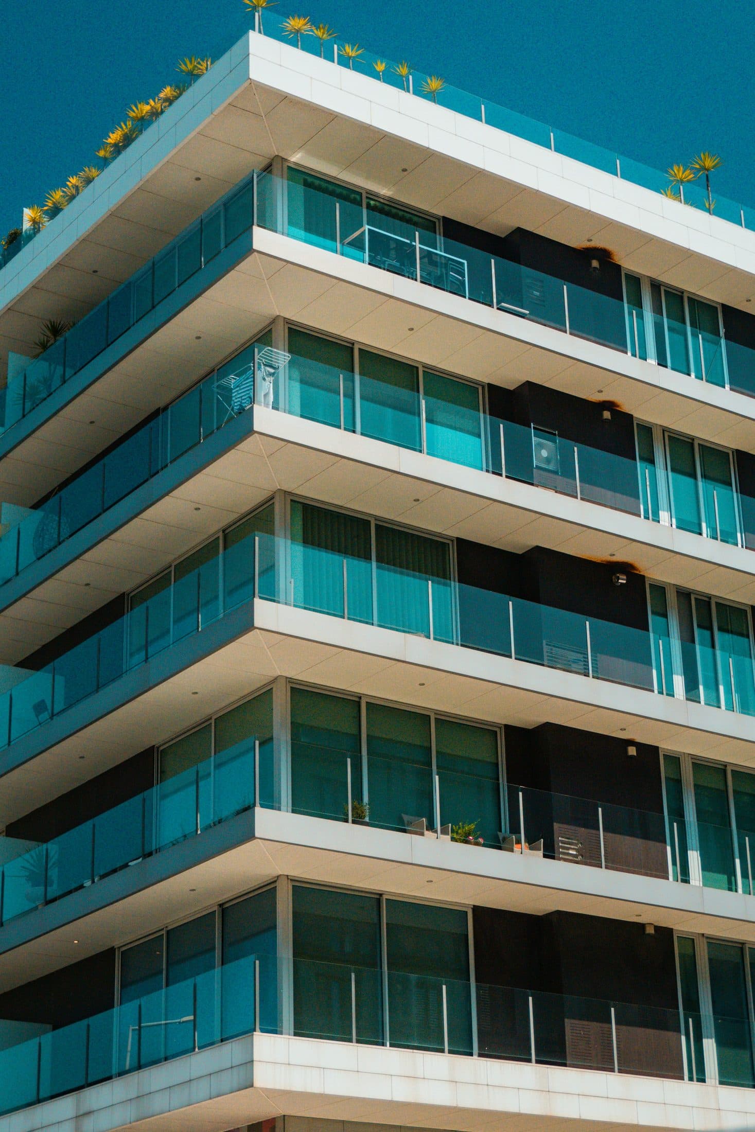Demo image. Glass-fronted balconies on a residential building.